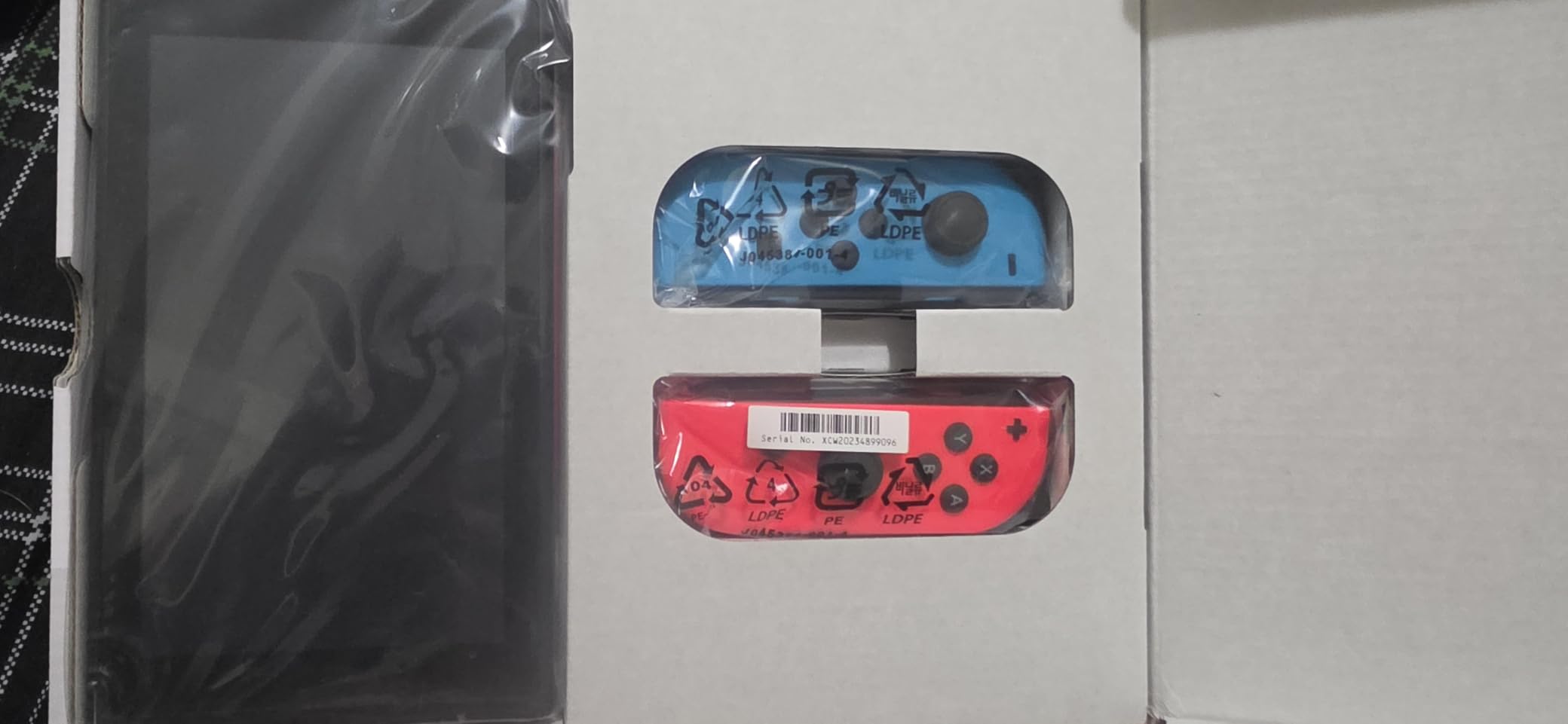 Nintendo Switch with Neon Blue and Neon Red Joy‑Con customer photo 1
