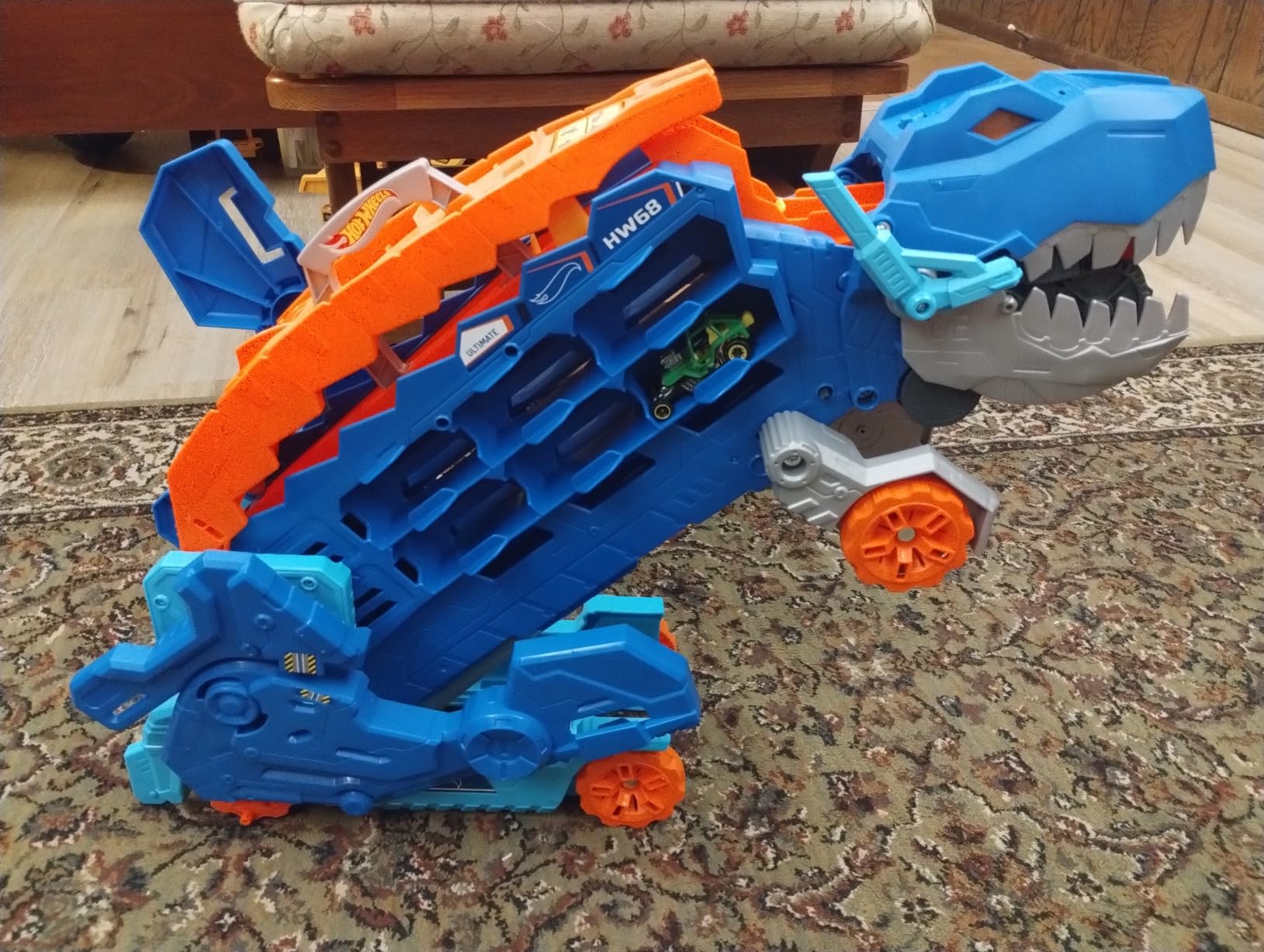 Hot Wheels City Toy Car Track Set, Ultimate T-Rex Transporter, Hauler Transforms into Stomping Dino with Race Track, from Netflix Series “Let’s Race” customer photo 2